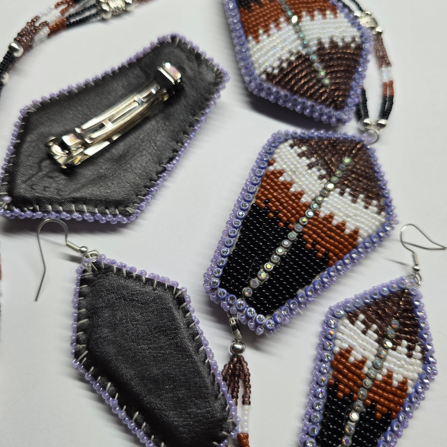 Beaded brown feather set.