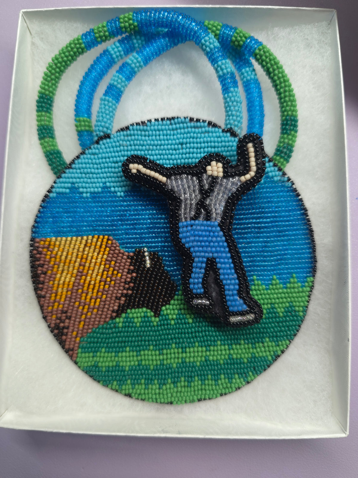 Beaded medallion buffalo and spinning man