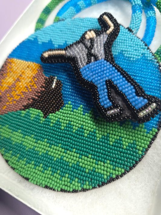 Beaded medallion buffalo and spinning man