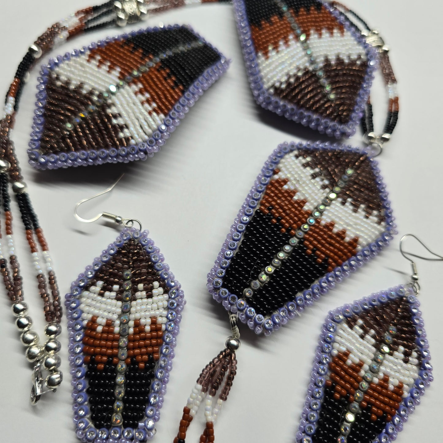 Beaded brown feather set.